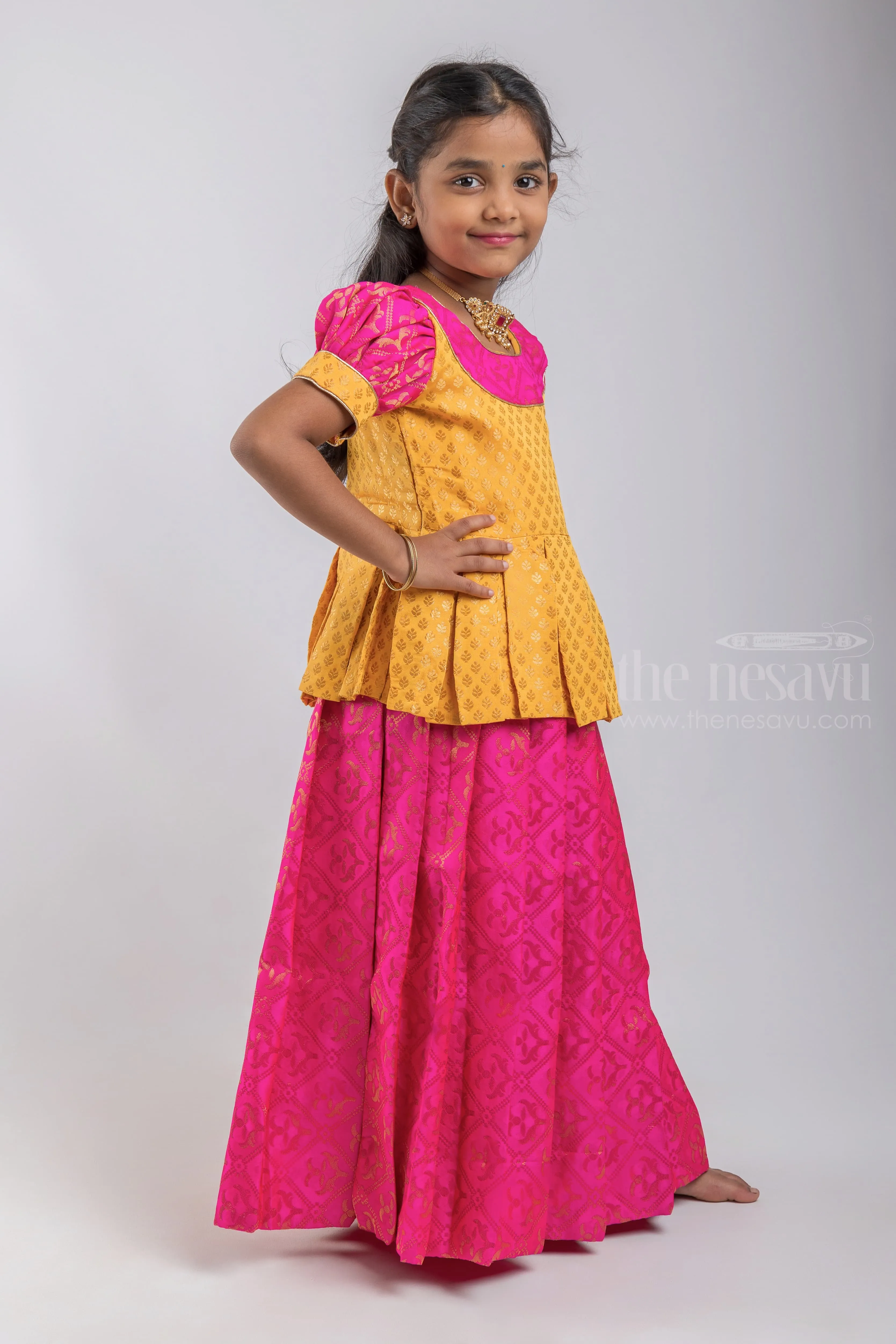 Premium Yellow Brocade Designer Pleated Blouse And Pink Floral Designer Silk Skirt For Girls