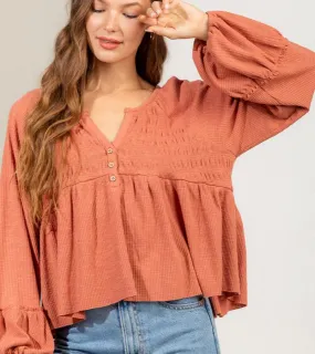 Rust balloon sleeve knit top